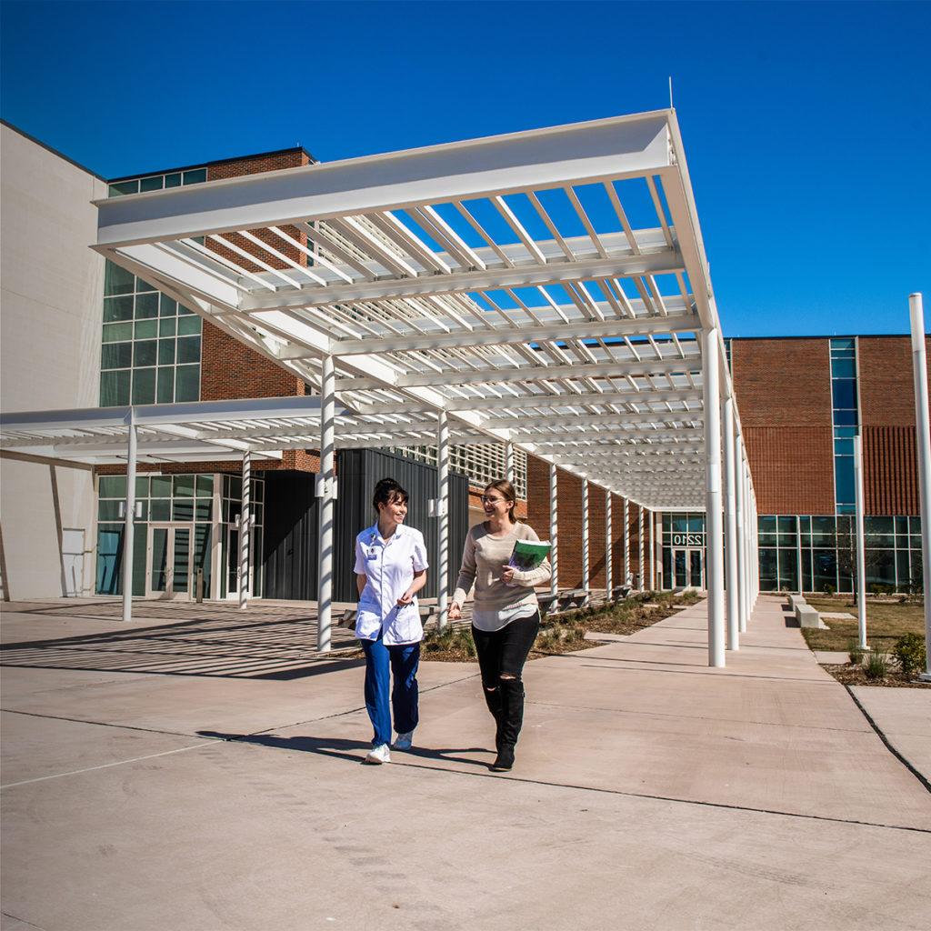 Students departing nursing and health sciences building.